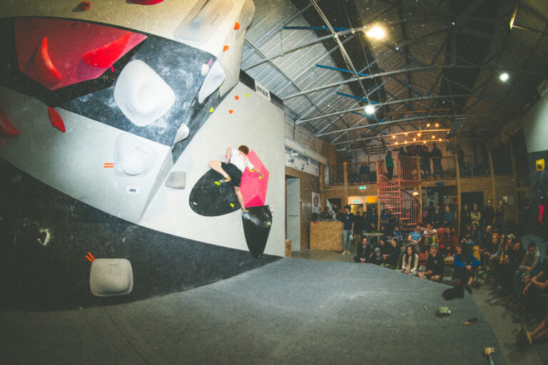 Climber mid-move at the City Bloc Winter League Final 2026